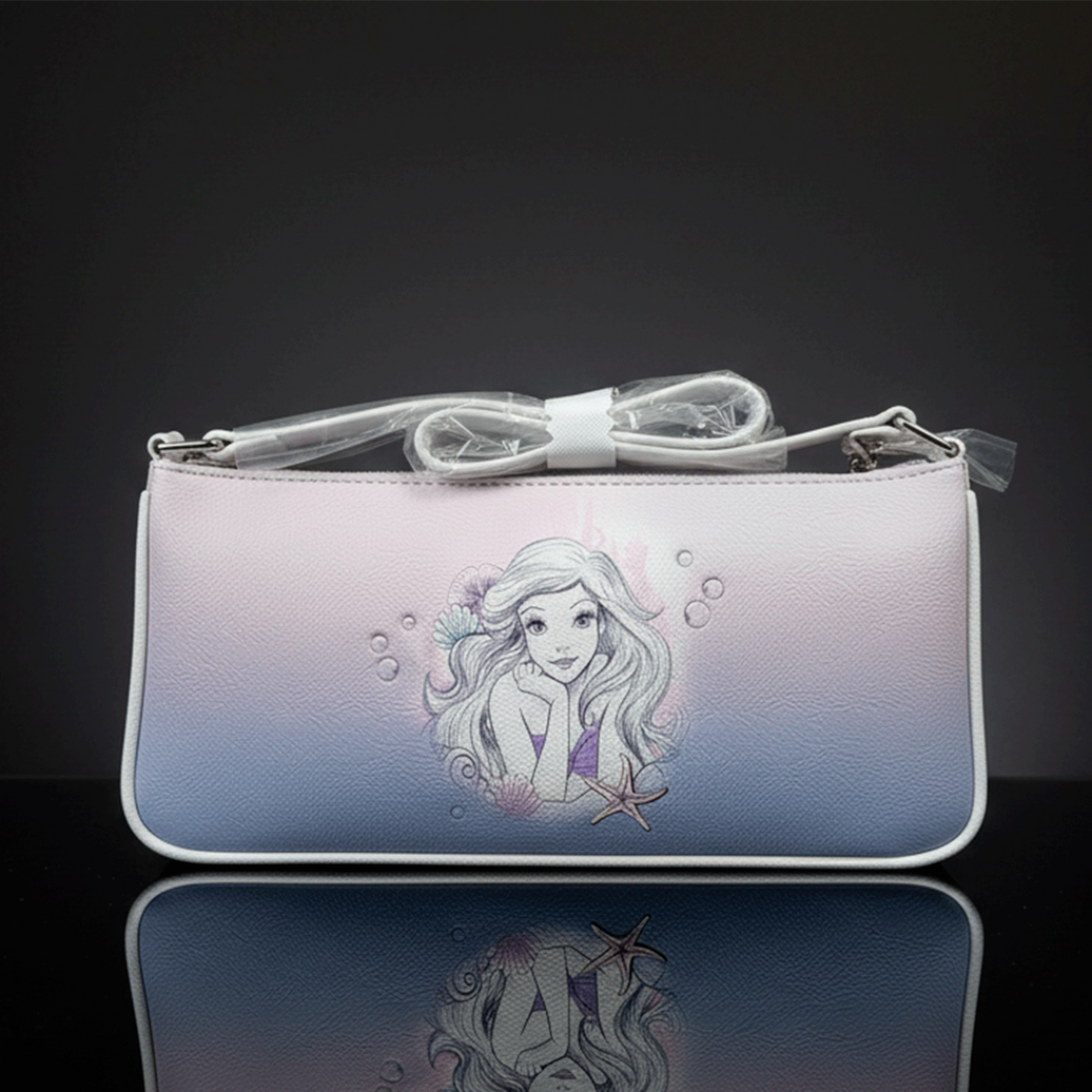 Danielle Nicole baguette bag featuring pastel Ombre background with Ariel illustration and starfish detail on front