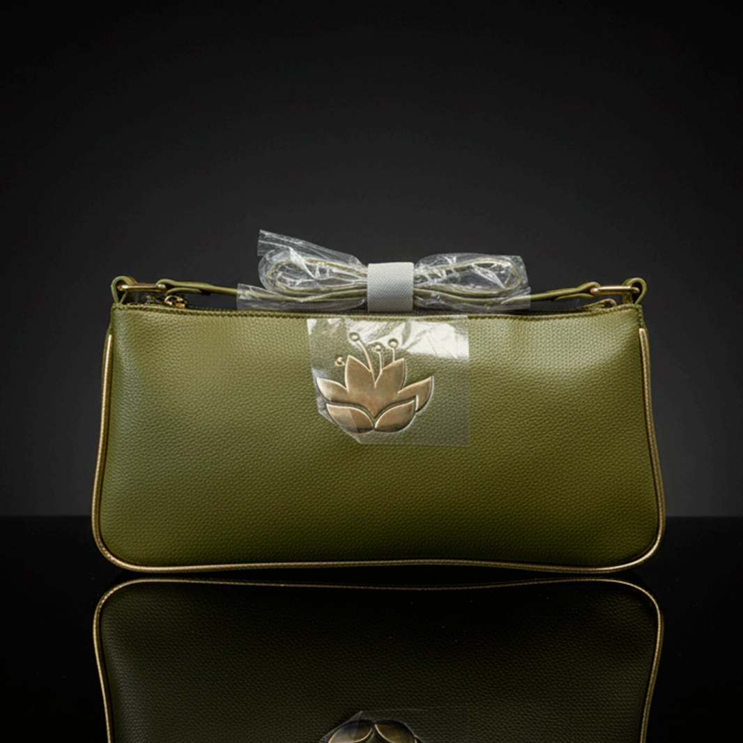DANIELLE NICOLE green shoulder bag inspired by Disney Princess Tiana with floral emblem and wrapped strap