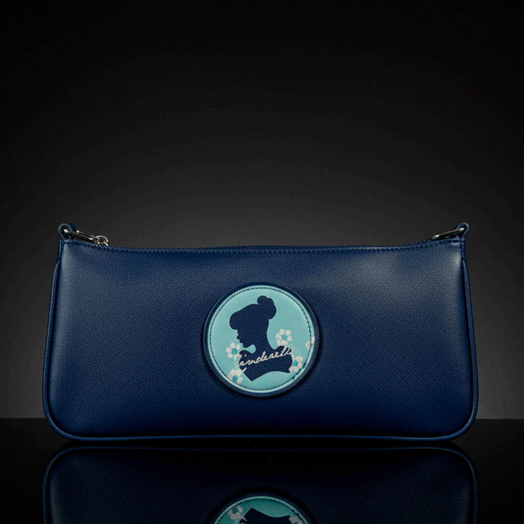 Danielle navy blue baguette bag with Cinderella silhouette and floral accents on round patch in center front