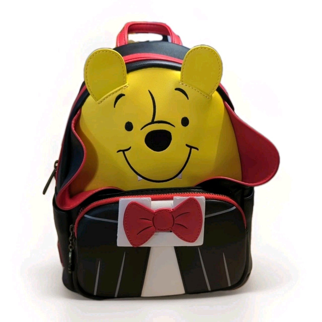 Loungefly mini backpack featuring Winnie the Pooh in vampire cosplay with red bow tie and cape details