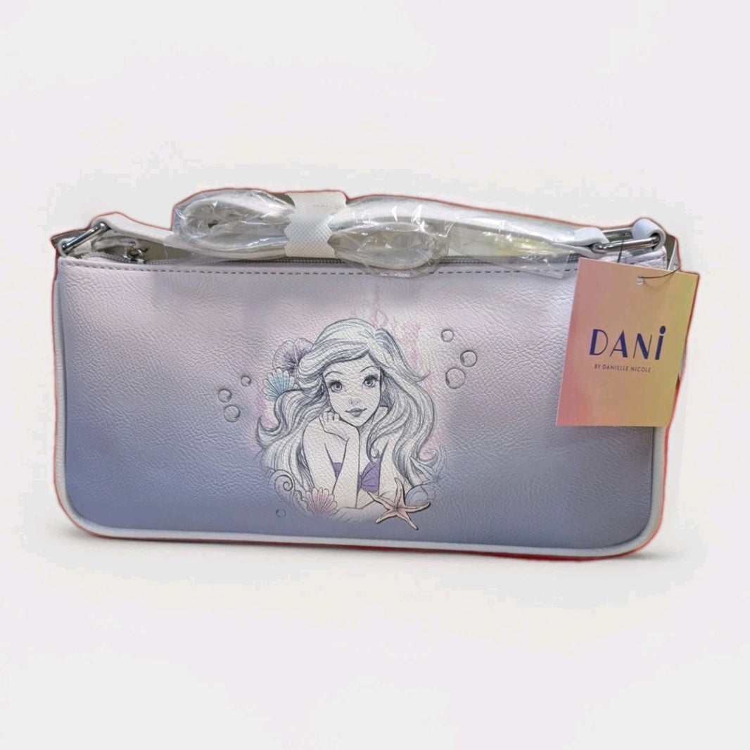 Danielle Nicole baguette bag with Ariel sketch and starfish detail on soft gradient purple background, new with tags