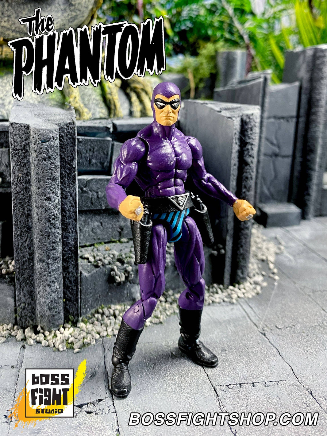 Boss Fight Studio Llc 6-inch Phantom Hero figure in deep purple suit standing in outdoor rocky terrain with clenched fists