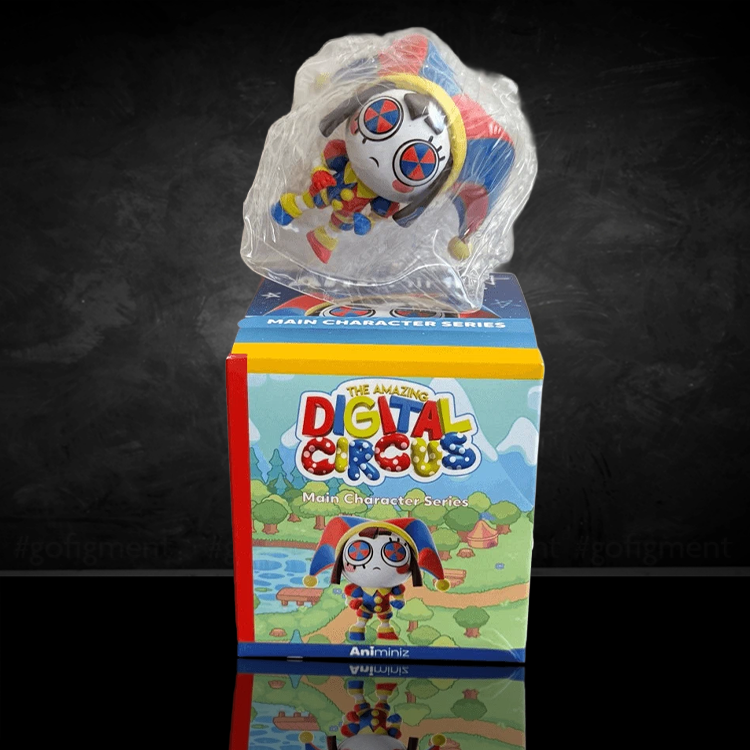 Pomni Animiniz figure from Glitch’s The Amazing Digital Circus, with jester outfit and pinwheel pupils, displayed above box.