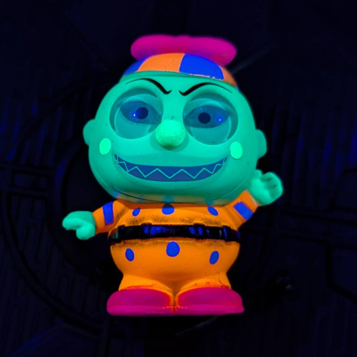 Go Figment black light figure with glowing green face and orange polka-dot outfit from Disney Doorables U-PICK series