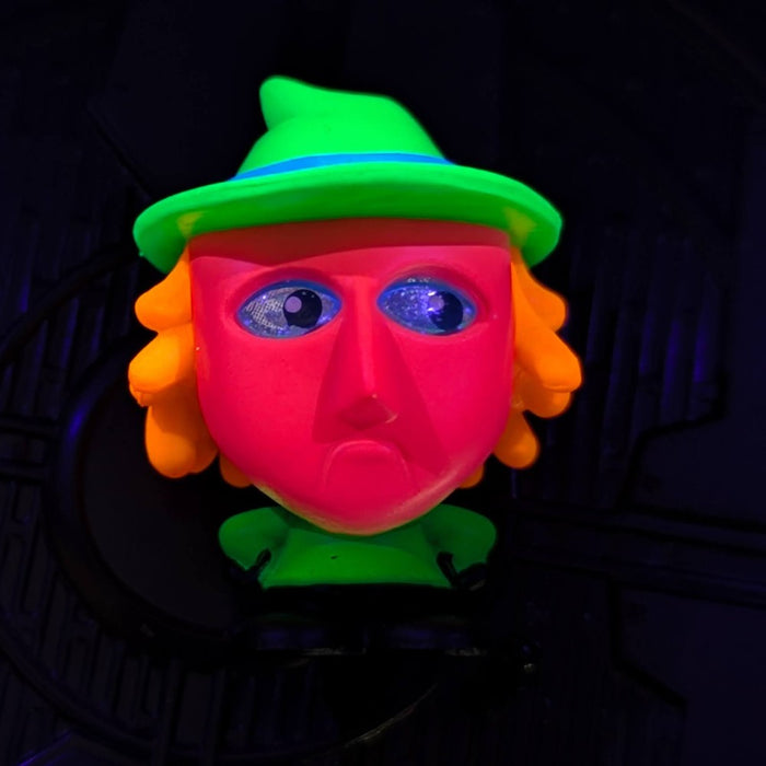 Go Figment black light figure of glowing red face with orange hair and green hat from Disney Doorables U-Pick series