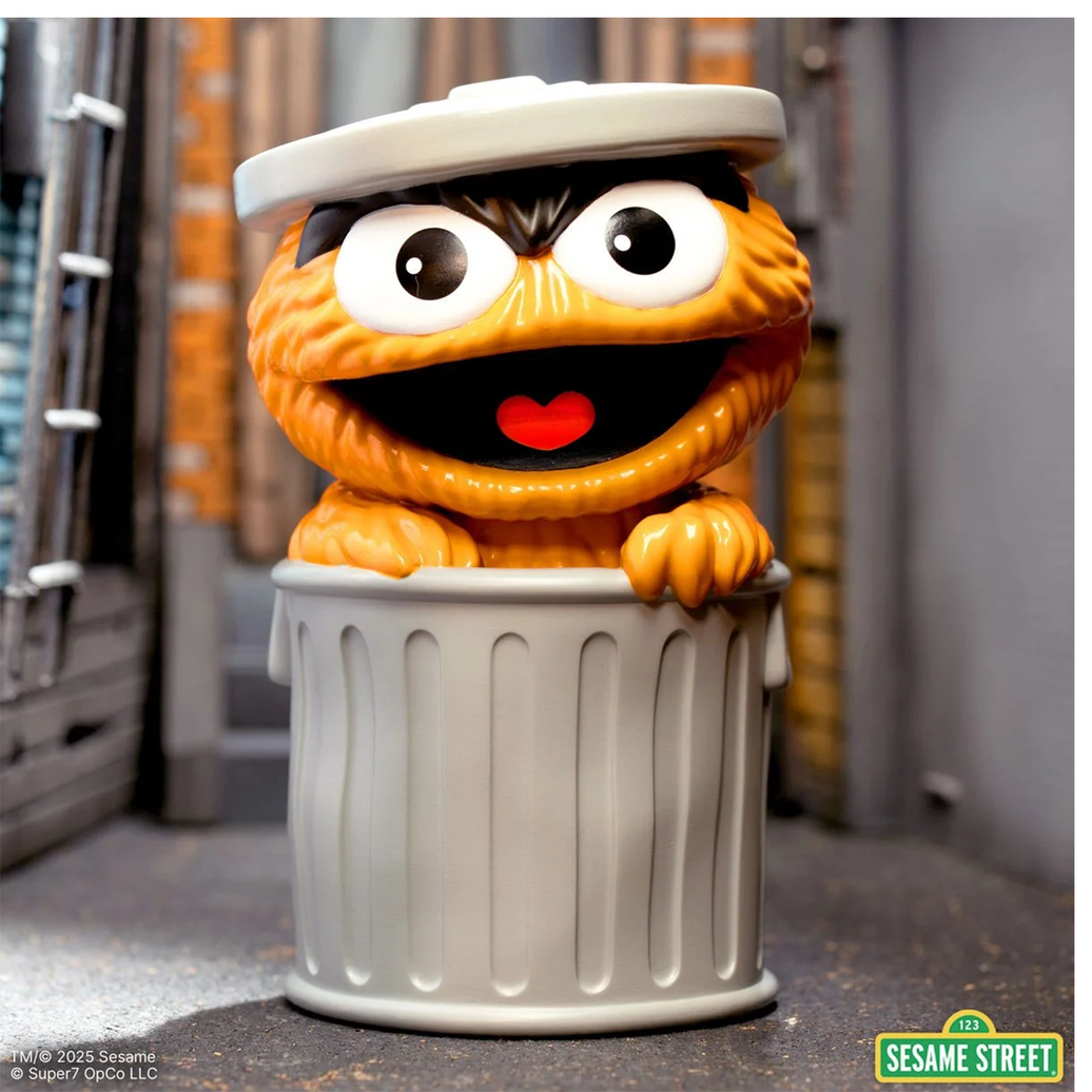 Sesame Street Oscar the Grouch (Orange) FUN! FUN! Vinyl Figure peeking out of a gray trash can collectible toy.