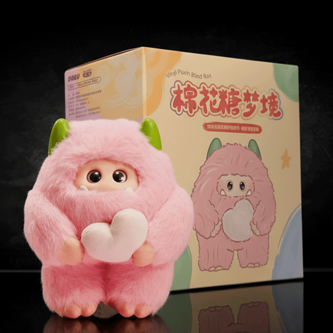 OHKU Giggle Monster Marshmallow Dreams pink plush with green horns holding heart-shaped accessory by blind-box packaging
