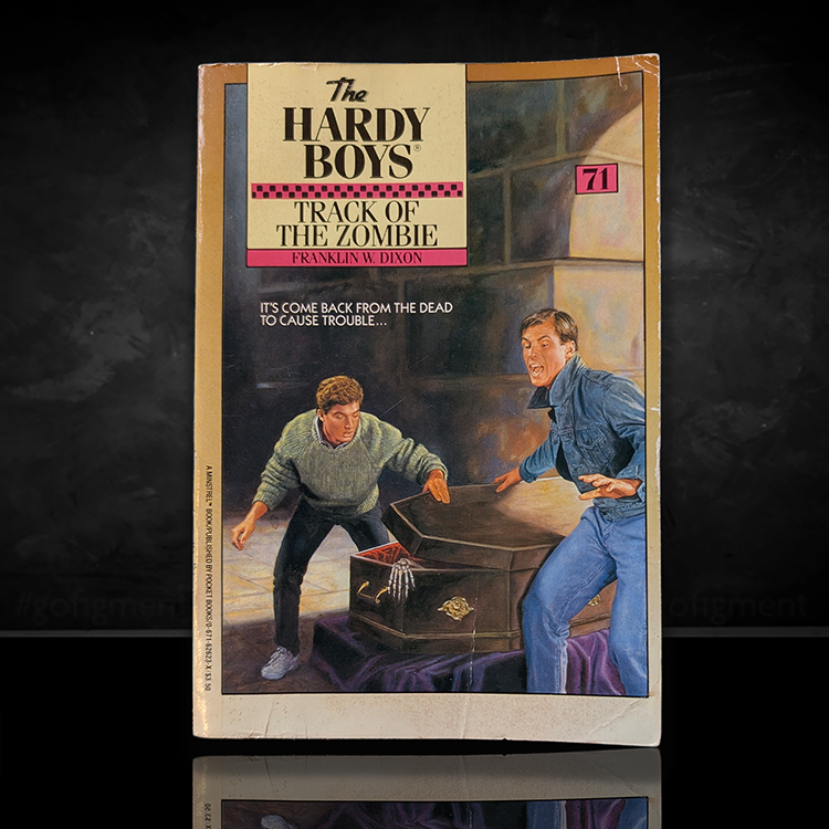 Vintage 1982 paperback of The Hardy Boys 71 Track of the Zombie by Simon & Schuster showing Frank and Joe Hardy startled by a coffin.