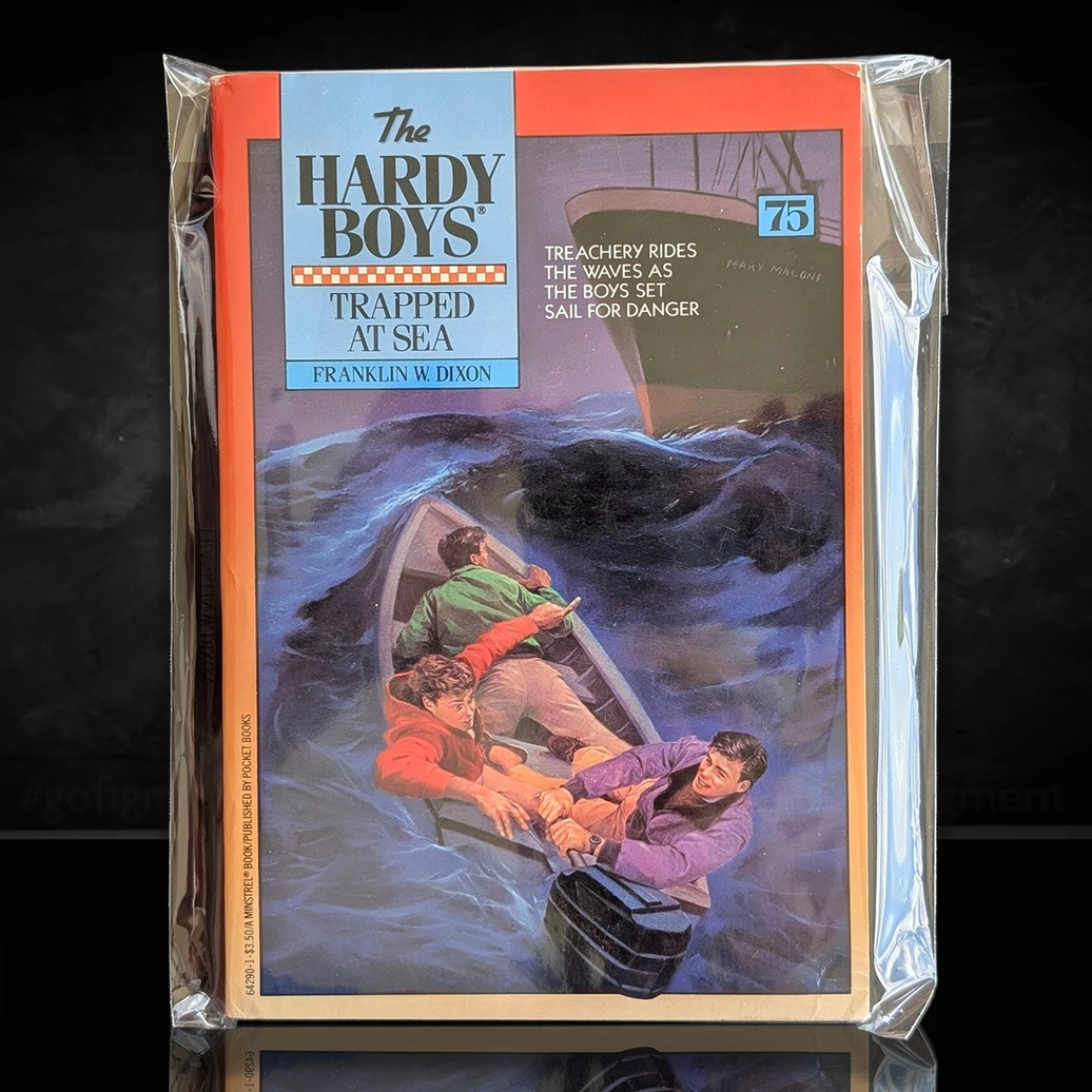 Image of a Hardy Boys Paperback book featuring 75 Trapped at Sea - The Hardy Boys Paperback Book - Vintage 1982