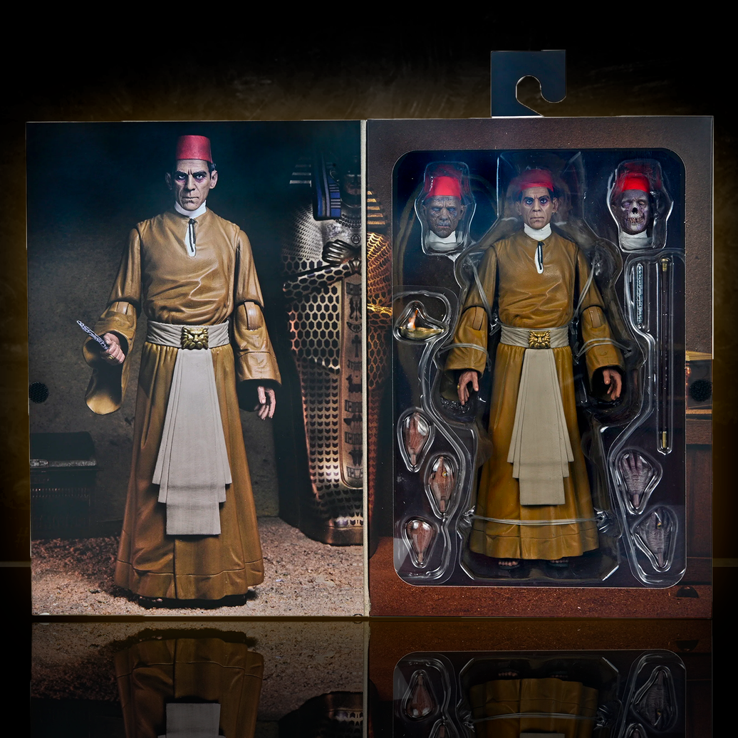 Neca 7-inch The Mummy Ardath Bey action figure with interchangeable heads and Egyptian staff in collector packaging