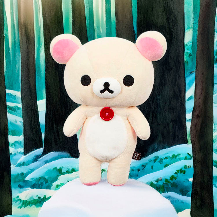San-X Korilakkuma 13.5 inch plush with iconic red button standing against a snowy forest background