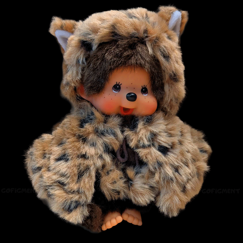 Sekiguchi Monchhichi 8-inch plush monkey wearing leopard hood and cape with thumb in mouth pose