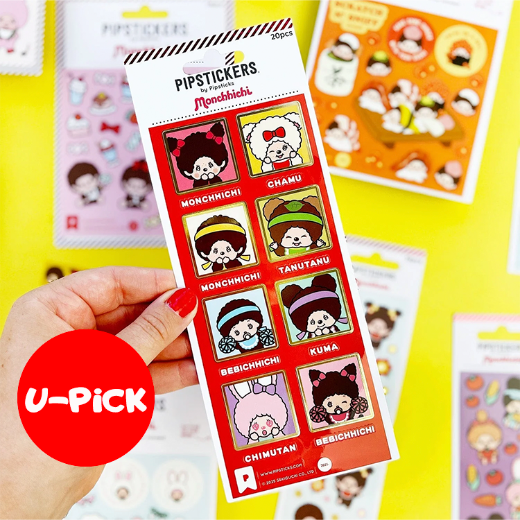 Hand holding PipStickers Monchhichi PVC sticker sheet with gold foil accents and kawaii character designs