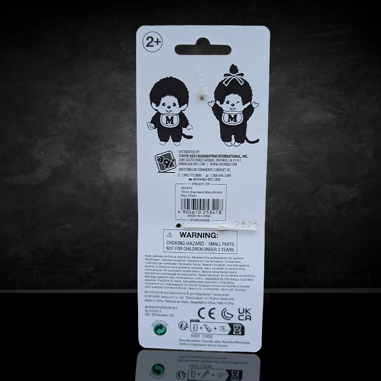 Back of Sekiguchi Monchhichi Classic Boy plush keychain packaging with product details and warnings.