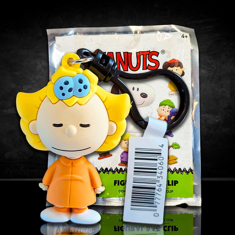 Monogram Peanuts Series 4 Sally Brown figural bag clip in orange outfit with black carabiner clip packaging visible