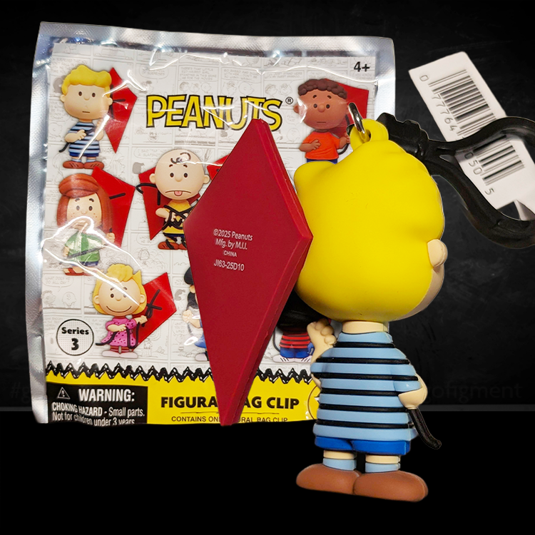 Monogram Peanuts 75th Anniversary Schroeder 3D foam bag clip holding a red kite wearing blue shorts and striped shirt
