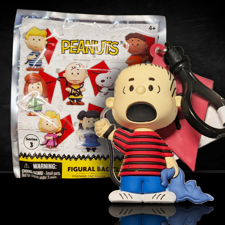 Monogram Linus Peanuts 75th Anniversary Series 3 foam bag clip holding blue blanket and red kite keychain