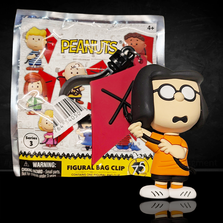 Marcie Peanuts 75th Anniversary foam bag clip by Monogram holding red kite in orange shirt and black shorts