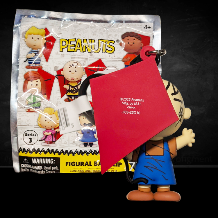 Monogram Peanuts 75th Anniversary Pig-Pen foam bag clip with blue overalls, dirt squiggles, and red kite