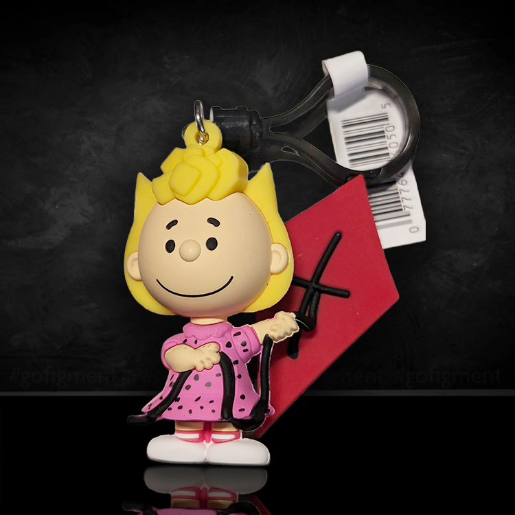 3D foam bag clip of Sally Brown in pink dress holding a red kite from Monogram Peanuts 75th Anniversary Series 3