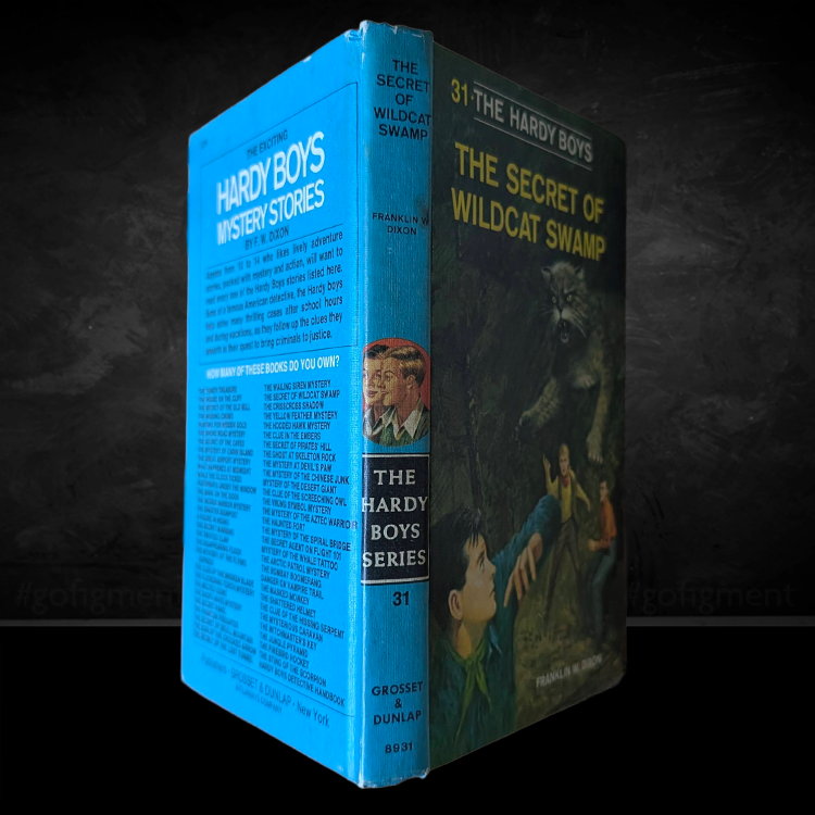 Vintage blue hardcover of The Secret of Wildcat Swamp, Hardy Boys book number 31 by Grosset & Dunlap