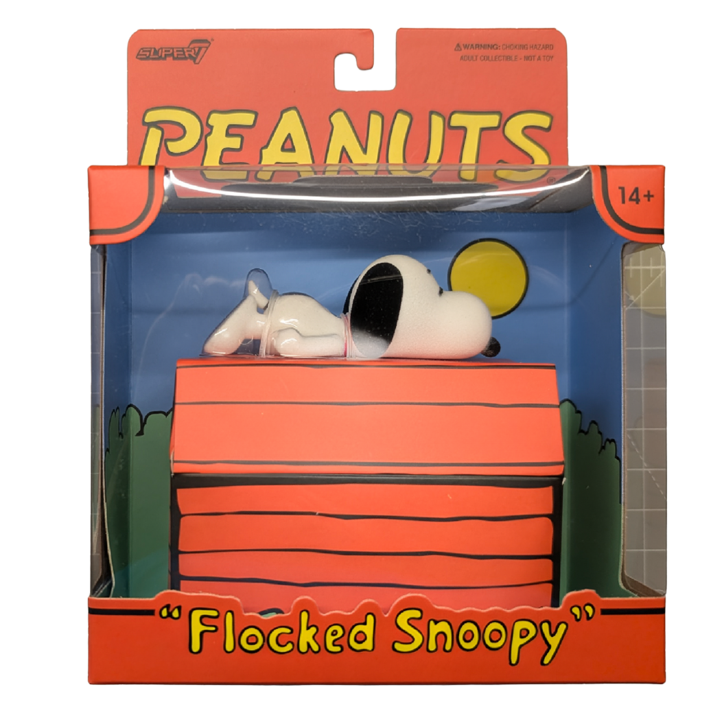 Flocked Snoopy figure lying on a red doghouse in Peanuts packaging