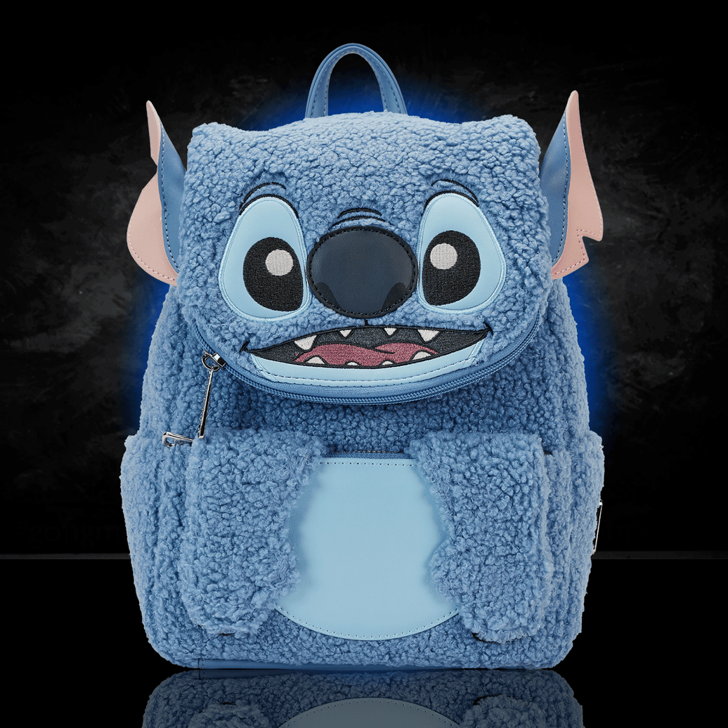 Loungefly mini backpack featuring blue plush sherpa Stitch design with large eyes, ears, nose, and toothy smile details
