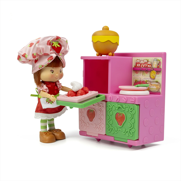 Loyal Subjects Strawberry Shortcake doll in baking outfit with pink and green Berry Bake Shoppe oven playset