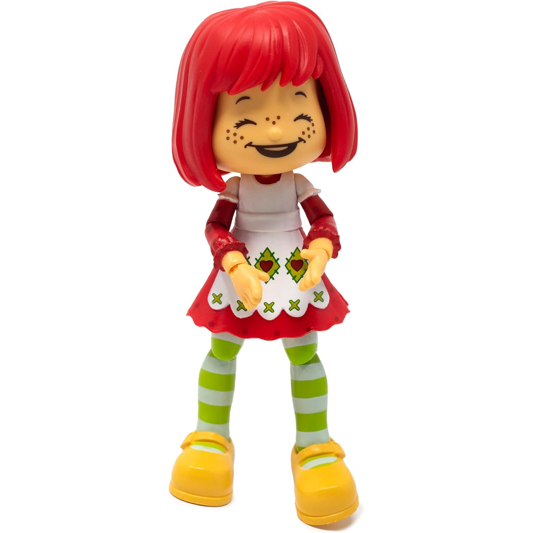 Boss Fight Studio Llc Strawberry Shortcake figure with red hair, apron dress, striped green leggings, and yellow shoes on display