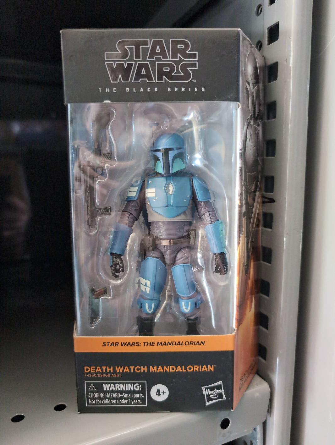 Hasbro Star Wars Black Series Death Watch Mandalorian action figure with weapons and blue armor in collector box