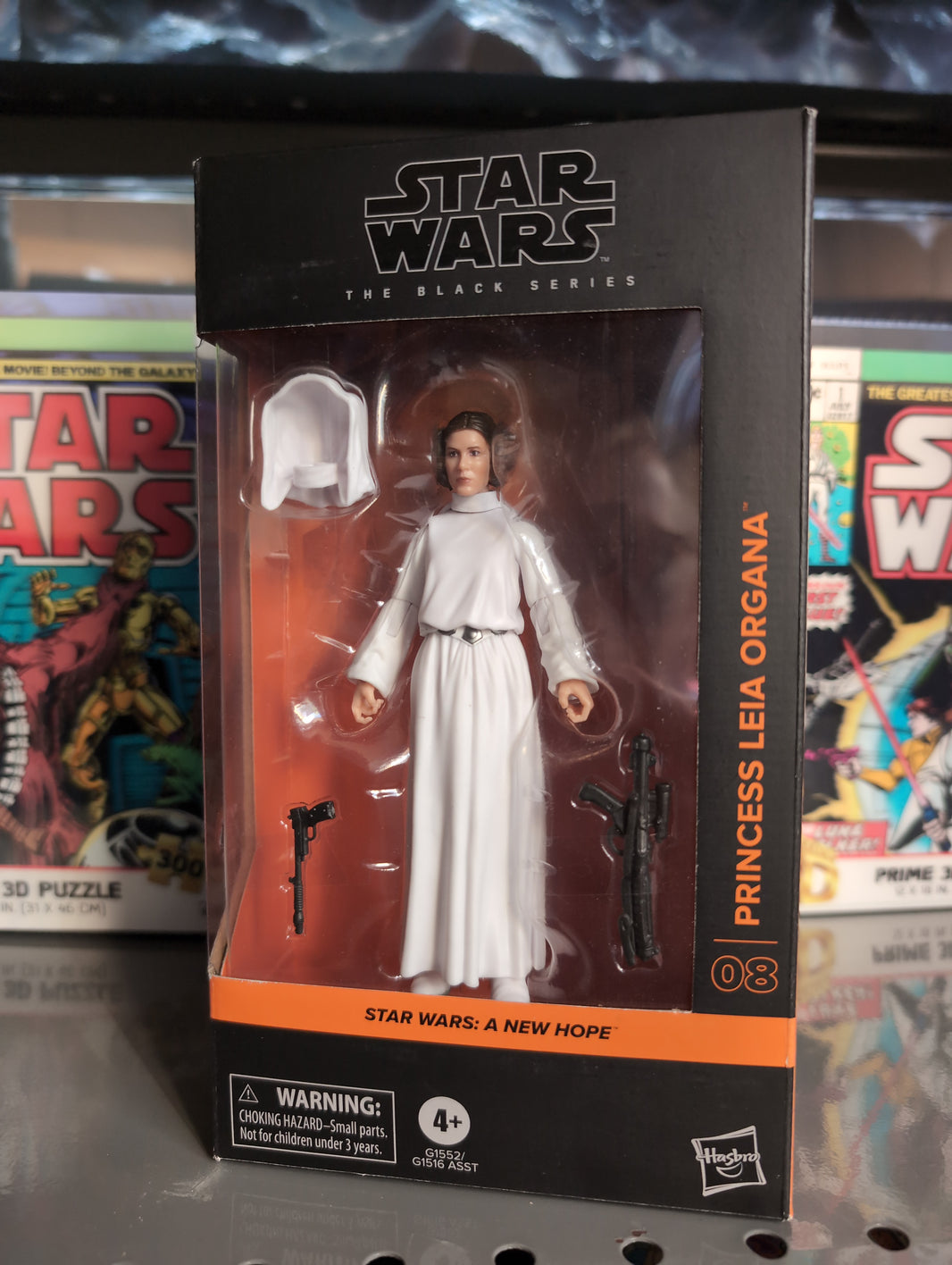 Hasbro Star Wars Black Series Princess Leia Organa figure in white robe with blasters and two hood options.