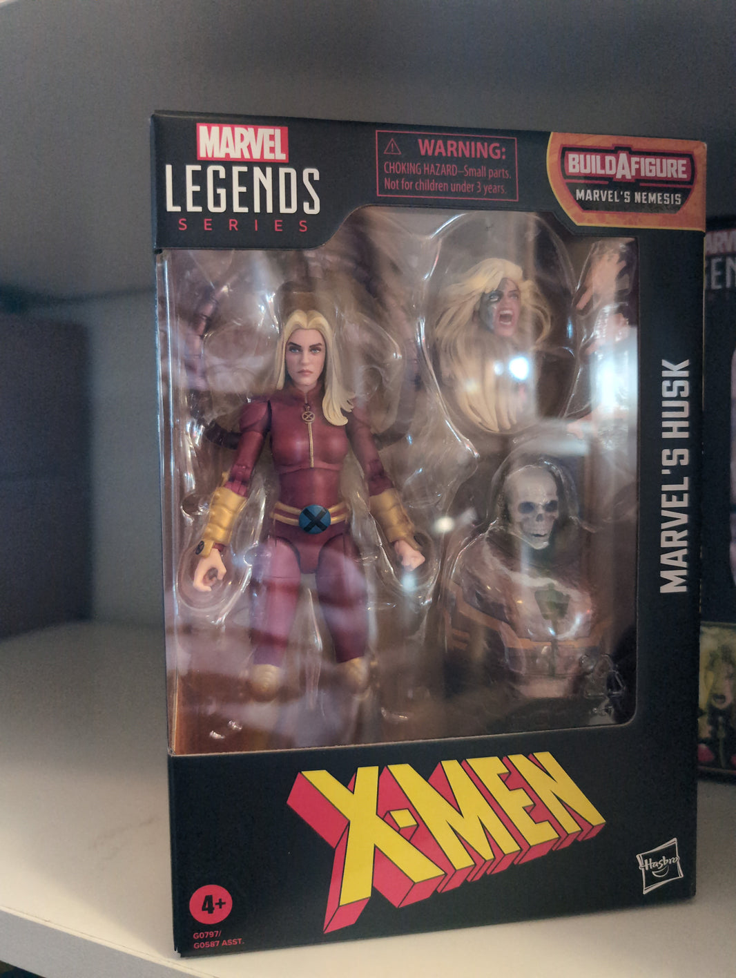 Hasbro Marvel Legends Husk action figure in original packaging with accessories from X-Men series.