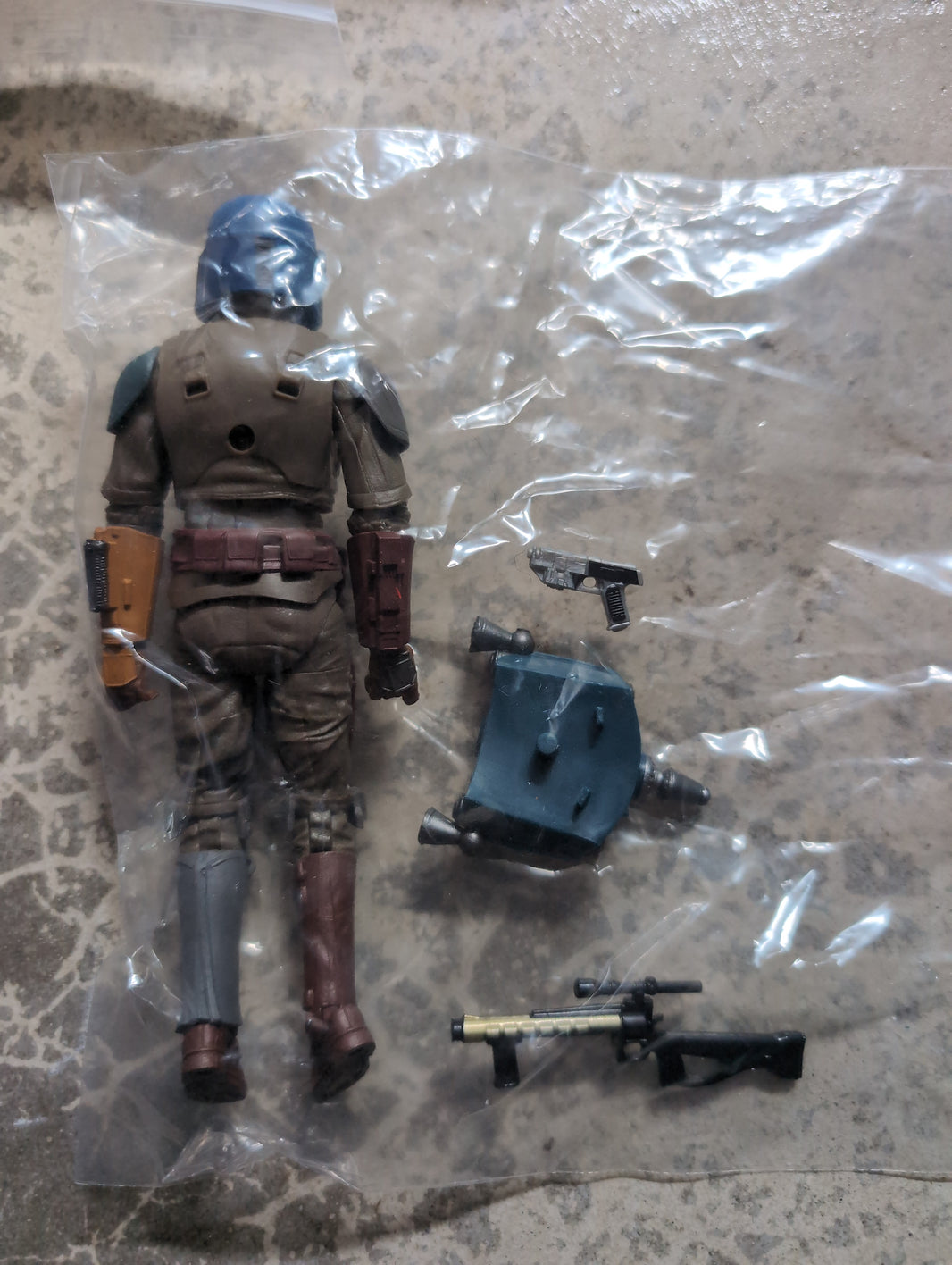 Hasbro Star Wars Shriek Hawk Trainer action figure with weapons and jetpack accessories in plastic bag