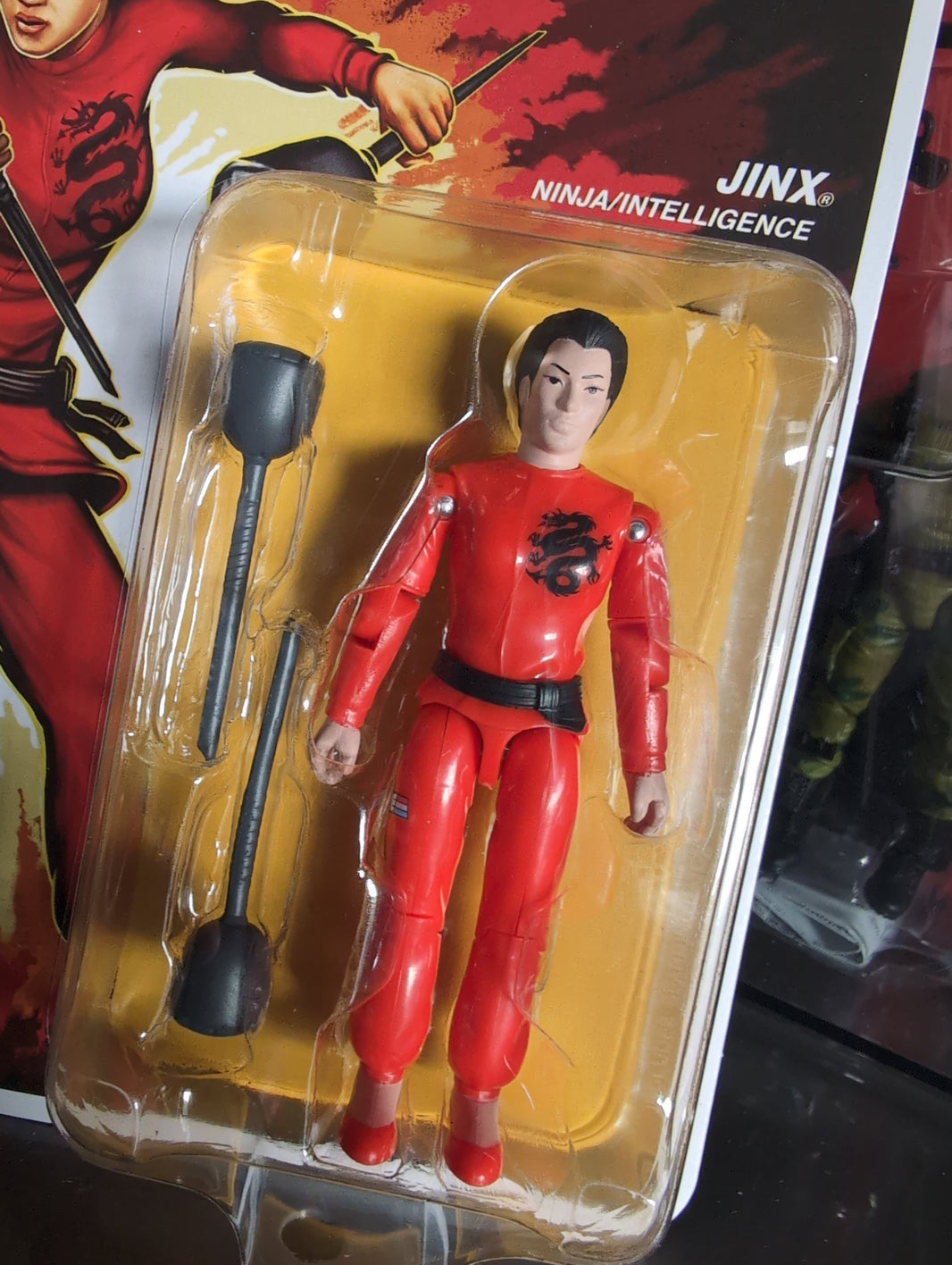Hasbro GI Joe Jinx Ninja action figure in red outfit with sparring batons in blister packaging