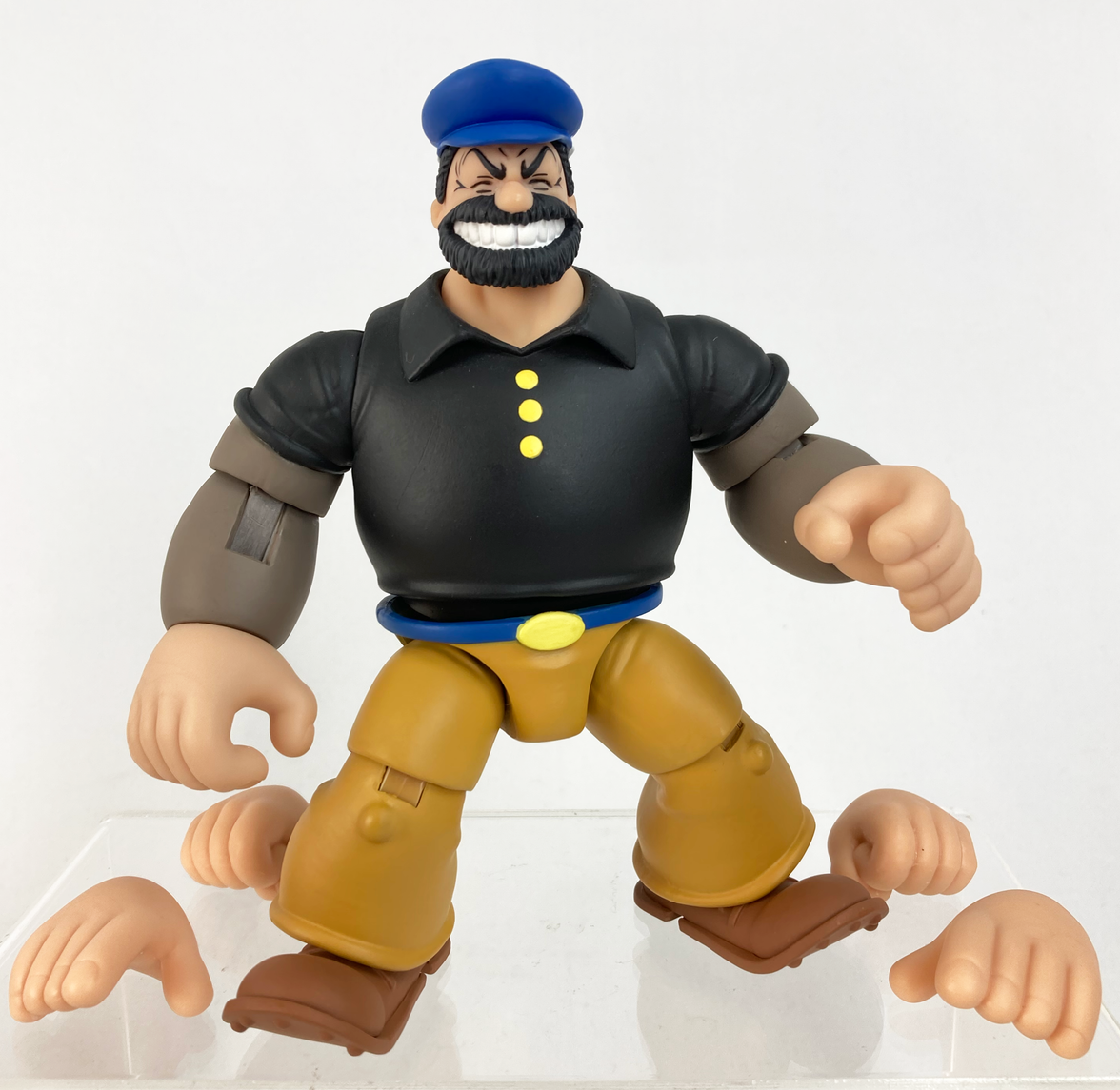 Boss Fight Studio Llc Bluto action figure in black shirt, brown pants, blue cap with extra interchangeable hands on white background