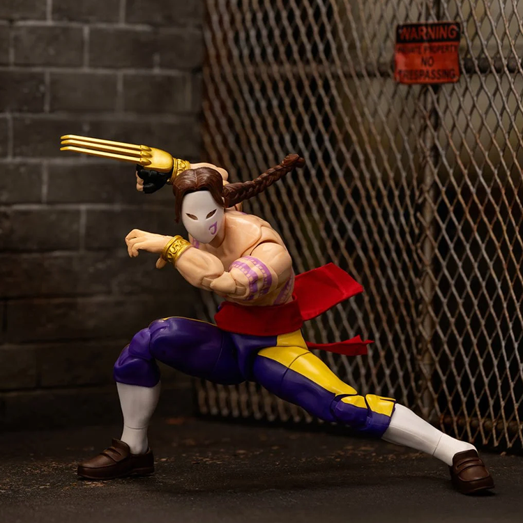 Jada Toys Ultra Street Fighter II Vega 6-inch action figure crouching with mask and clawed hand in dark industrial setting