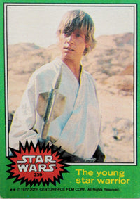 1977 Go Figment Star Wars trading card of young star warrior holding weapon in desert setting