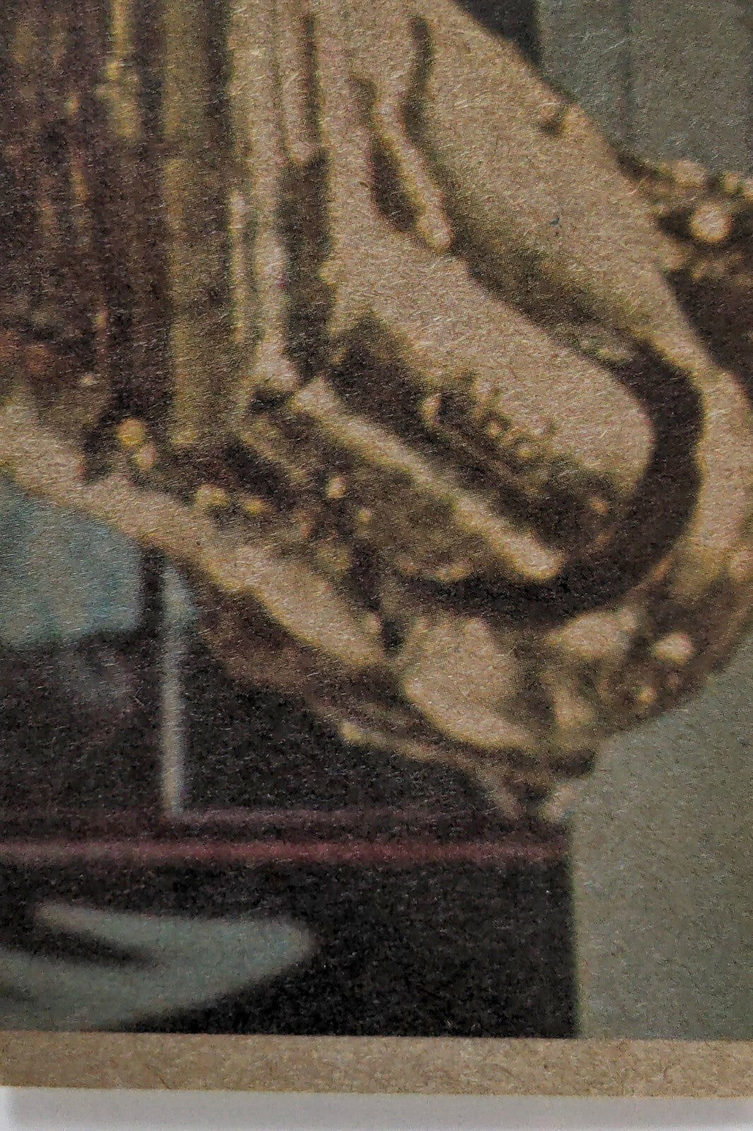 Close-up detail of vintage Hardy Boys book cover showing textured illustration and muted color palette