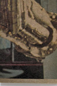 Close-up detail of vintage Hardy Boys book cover showing textured illustration and muted color palette