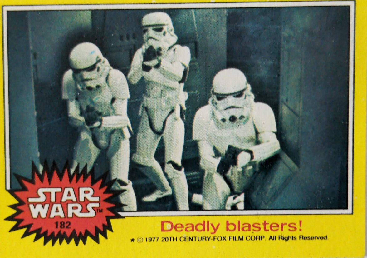 Vintage Star Wars card featuring three stormtroopers with blasters in a dark corridor scene