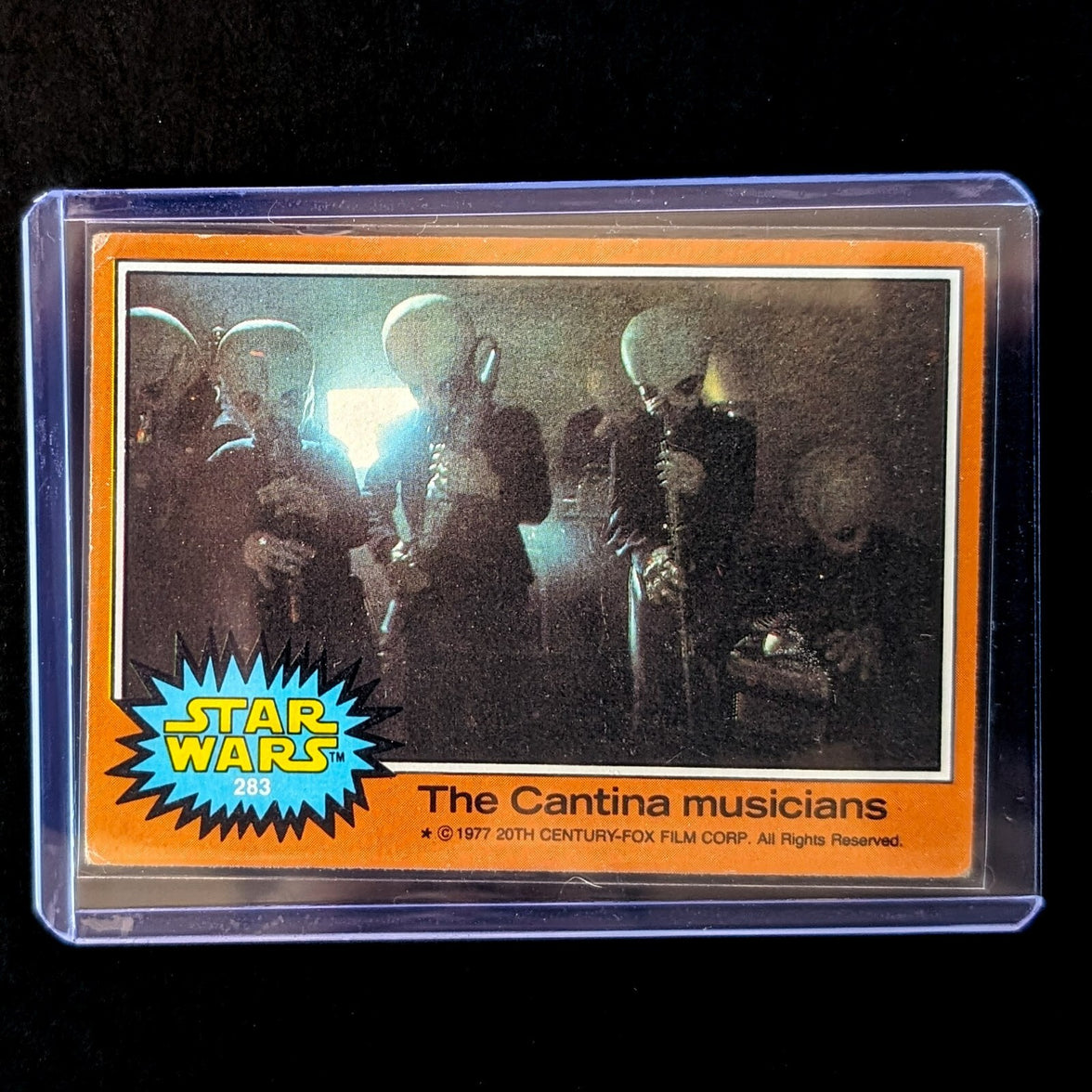 1977 TOPPS Star Wars Orange Series 4 card featuring The Cantina Musicians by Go Figment in protective case