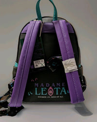 Loungefly mini backpack back view with purple straps and teal handle featuring Madame Leota inspired design on black faux leather