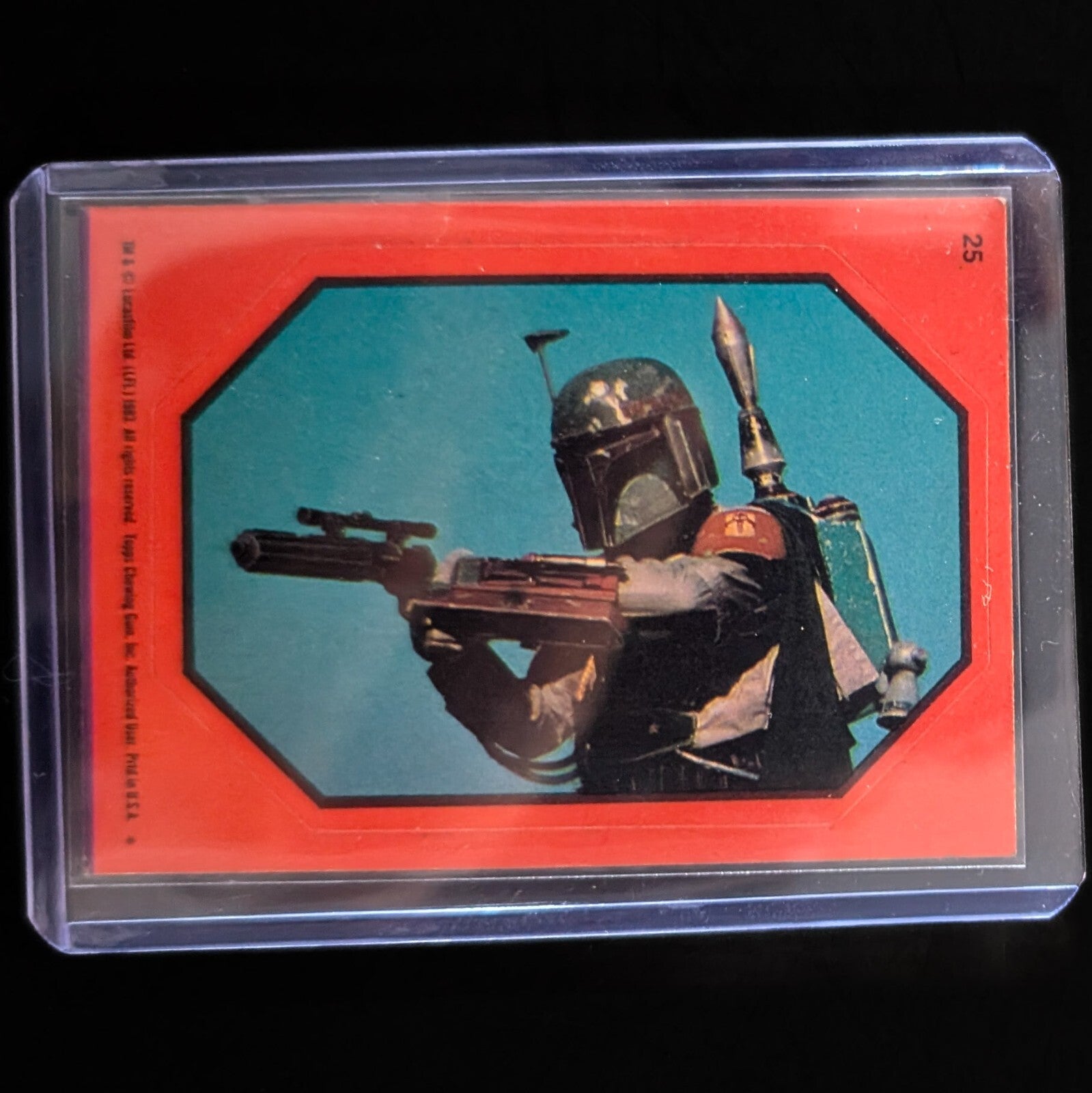 1983 Topps Return of the Jedi sticker featuring Boba Fett with blaster, vintage collectible sold by Go Figment