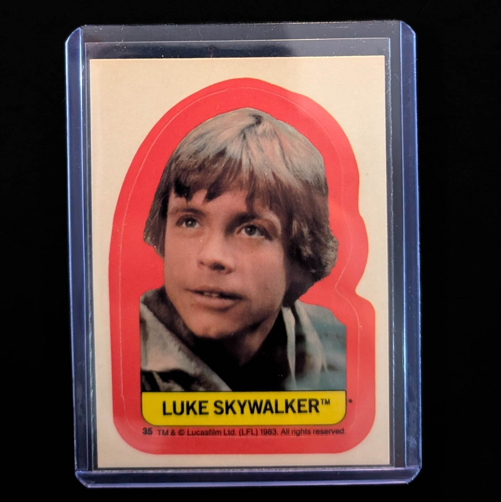 Vintage 1983 Luke Skywalker sticker from Go Figment's Topps Return of the Jedi series in protective case