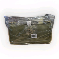 DANIELLE NICOLE green shoulder bag with floral cutout detail and packaged in clear protective plastic wrap