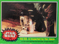 1977 Topps Star Wars Trading Card featuring R2-D2 inspected by Jawas, vintage collectible from Go Figment