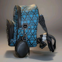 Loungefly Haunted Mansion mini backpack side view with blue damask design and attached round black cardholder pouch