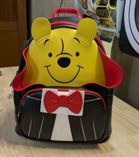 Loungefly mini backpack featuring Winnie the Pooh in a vampire outfit with red bow tie and cape details