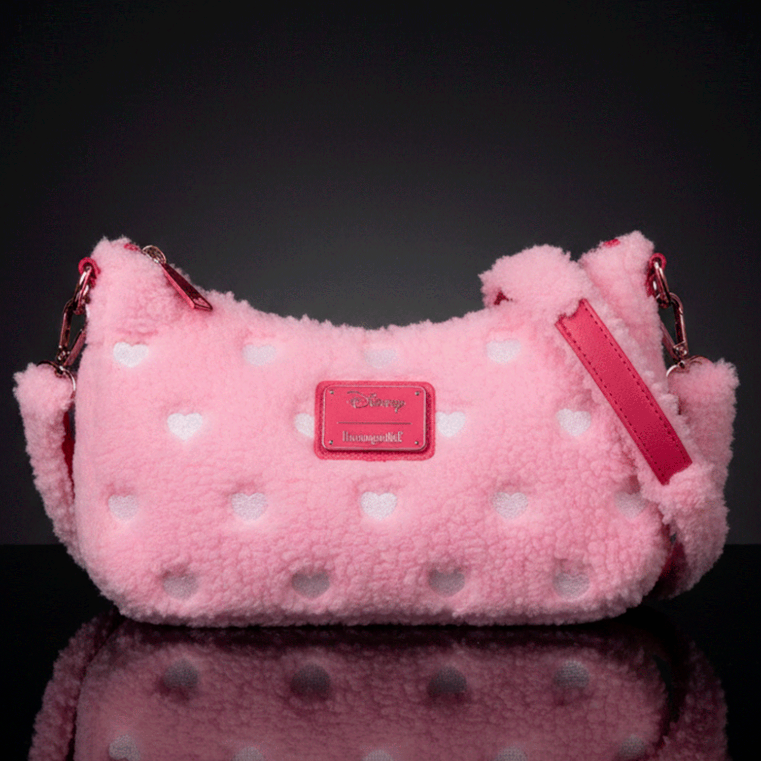 Loungefly pink sherpa crossbody bag with white heart accents and red leather details, Disney Minnie Mouse inspired design