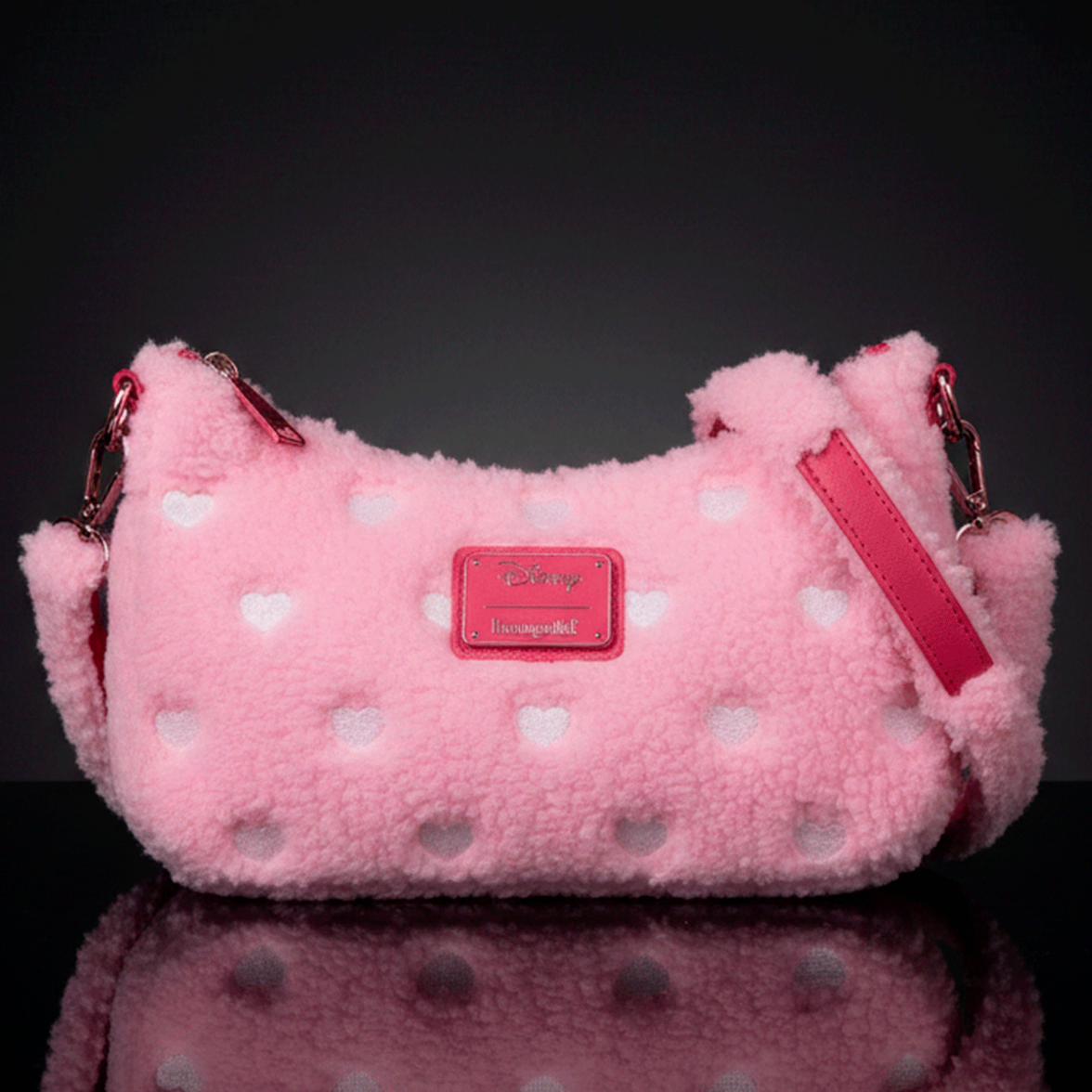 Loungefly pink sherpa crossbody bag with white heart accents and red leather details, Disney Minnie Mouse inspired design